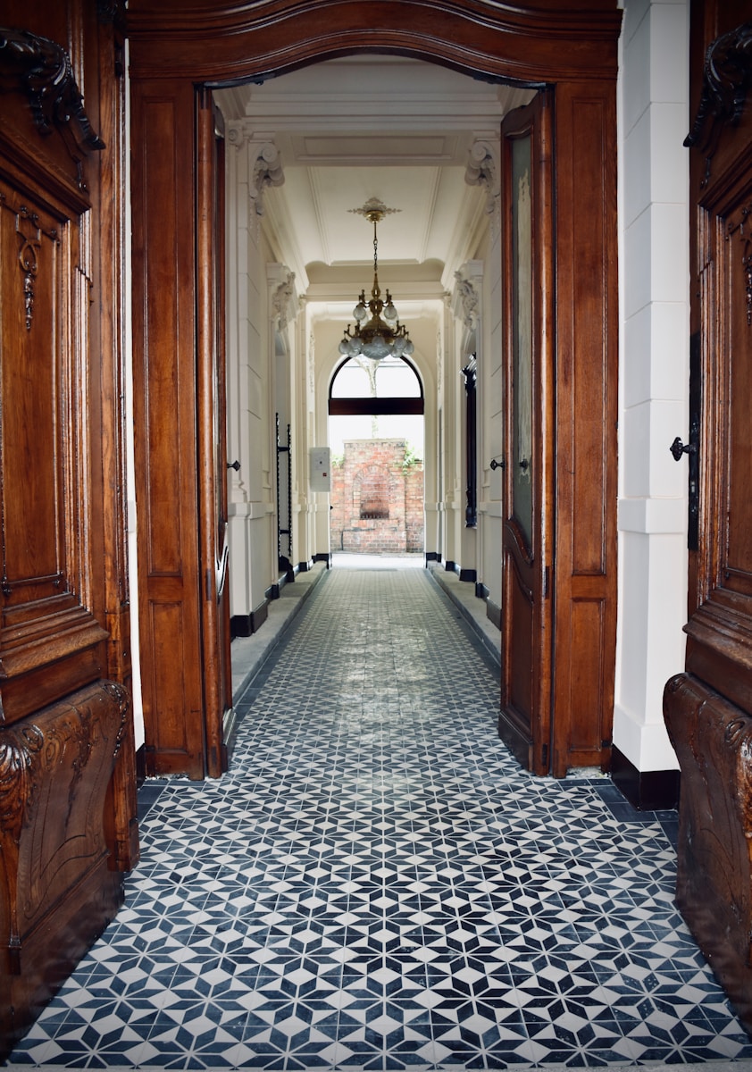 brown wooden door on hallway